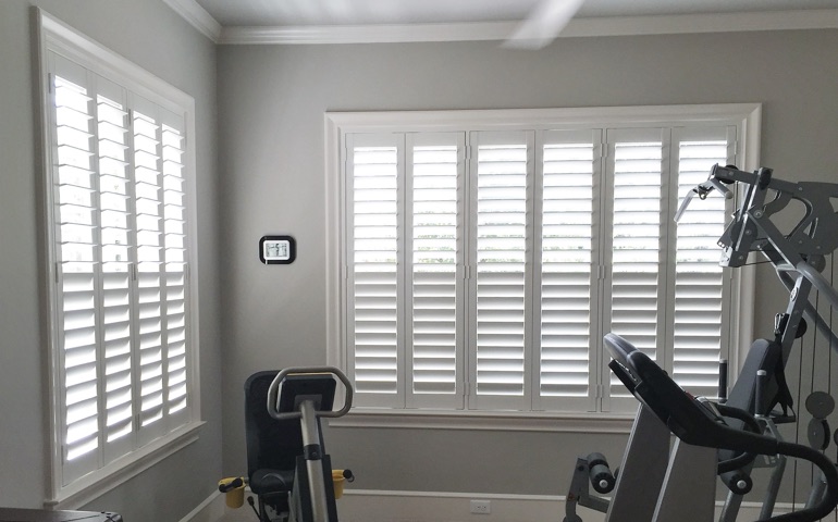 Seattle home gym with shuttered windows.